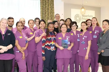 Moorfields Private teams holding a Doctify award trophy