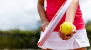 A young woman playing tennis