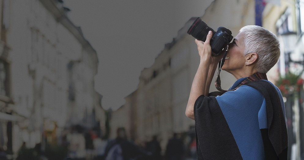 A woman taking a shot with her photo camera