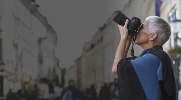 A woman taking a shot with her photo camera
