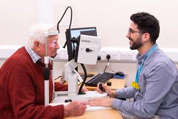 Man having his eyes examined