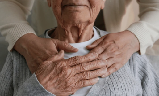 Photo of carer supporting a patient