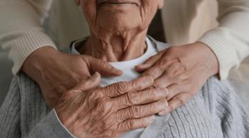 Photo of carer supporting a patient