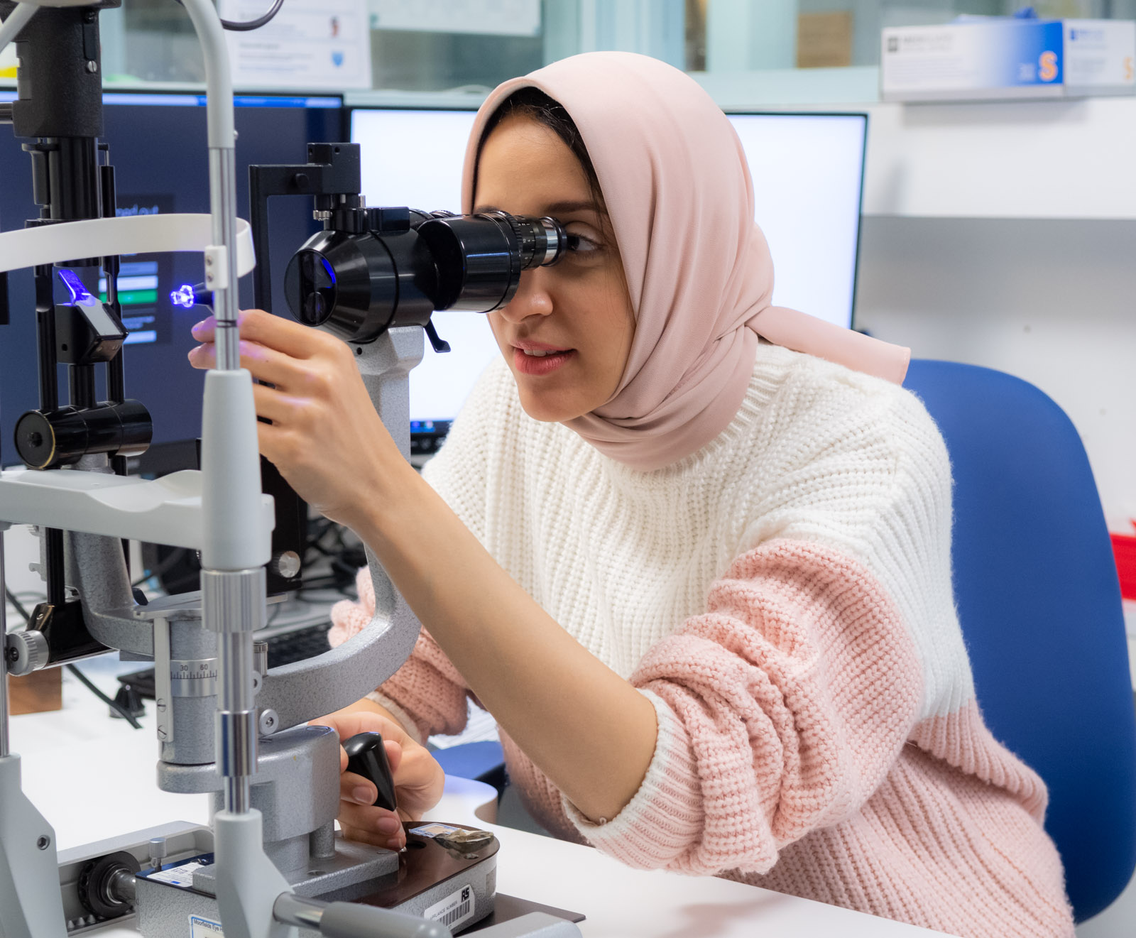 Staff member using a slit lamp