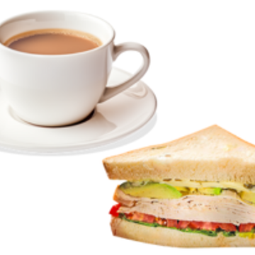 Cup of tea with a saucer and a chicken salad sandwich