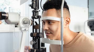 Person looking into a slit lamp