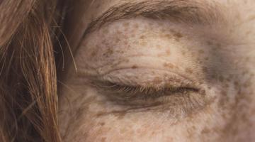 A closed woman's eye