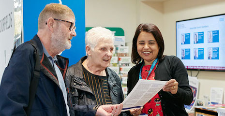 Photo of staff interacting with patients outside the Health Hub