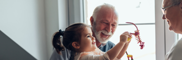 Grandparent and grandchild playing