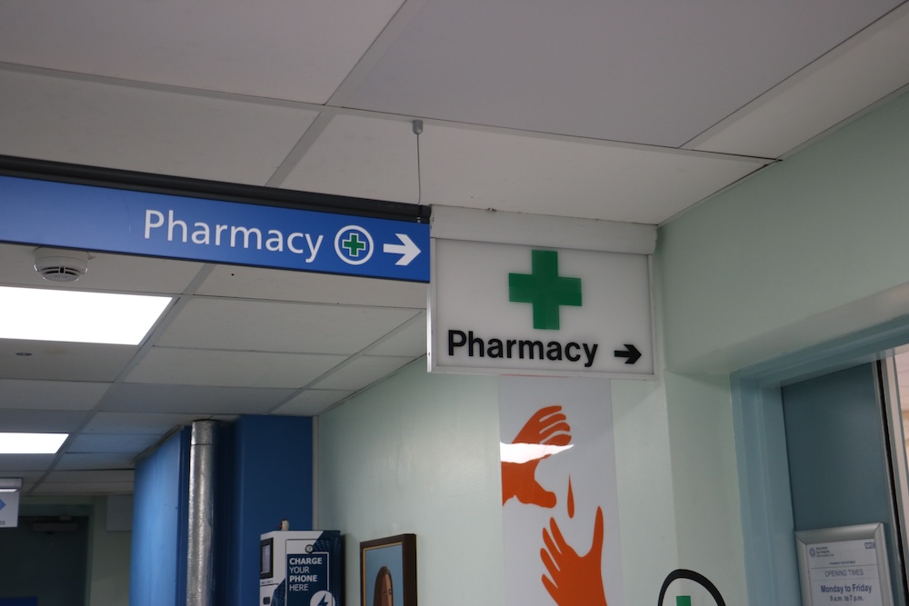 Pharmacy direction sign located in a hospital