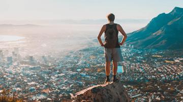 A person standing on a rock