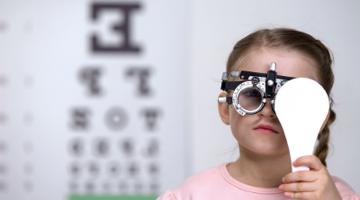 A young girl at the vision test