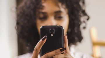 Woman Holding Mobile Phone