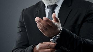 A mature man in a suite