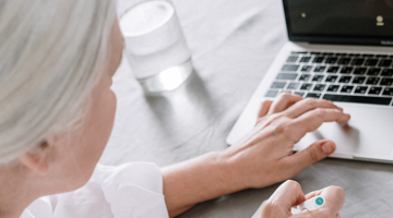 A woman typing on her laptop